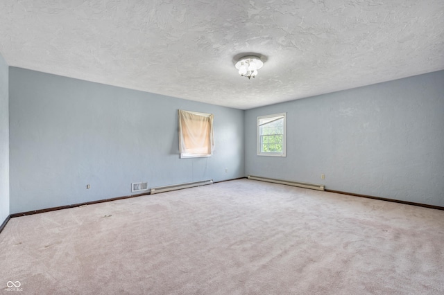 empty room featuring carpet flooring, a textured ceiling, and a baseboard radiator