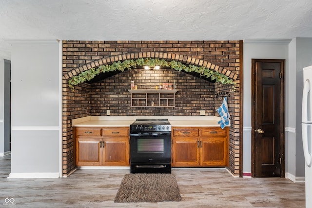 kitchen featuring black / electric stove, ornamental molding, a textured ceiling, and light wood-type flooring