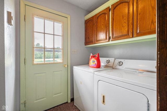 laundry room with cabinets and washer and clothes dryer