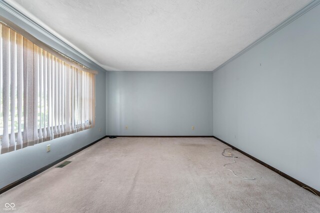 4832 E 200 N, Anderson, IN 46012 - spare room featuring carpet and crown molding