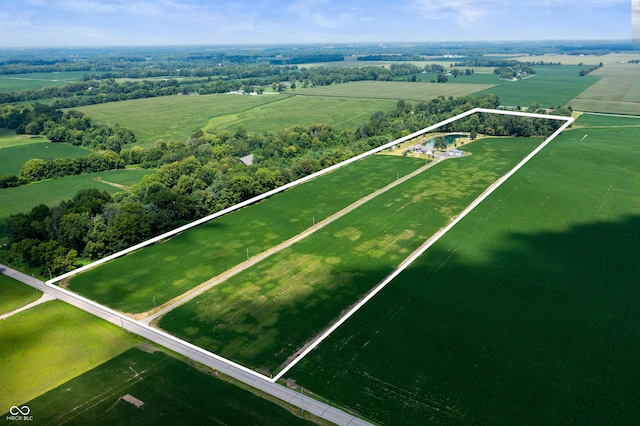 birds eye view of property featuring a water view and a rural view