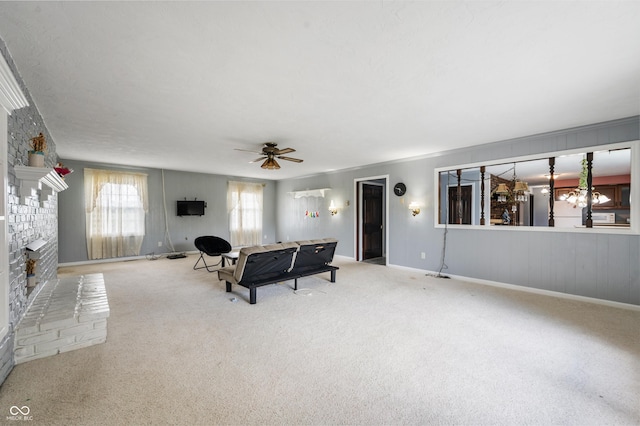 living room featuring ceiling fan, carpet floors, and a brick fireplace