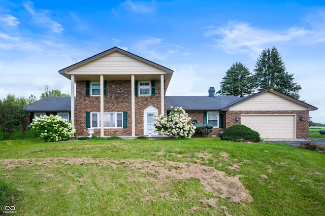 4832 E 200 N, Anderson, IN 46012 - greek revival house with brick siding, an attached garage, a front lawn, and driveway