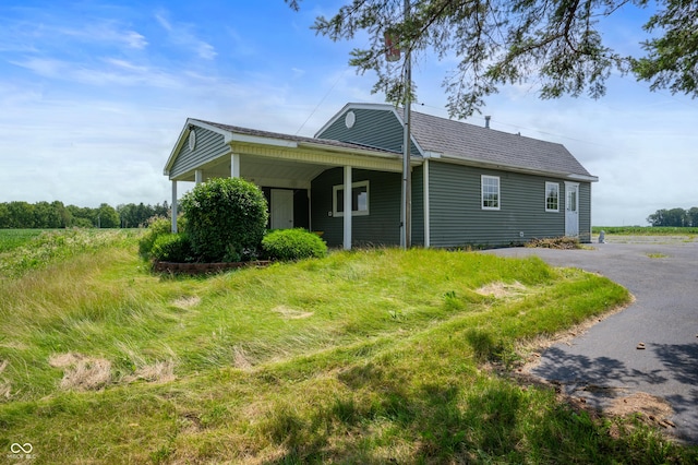 view of side of property with a carport