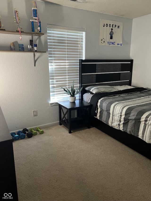 bedroom featuring multiple windows and carpet flooring