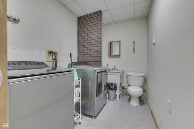 washroom with separate washer and dryer