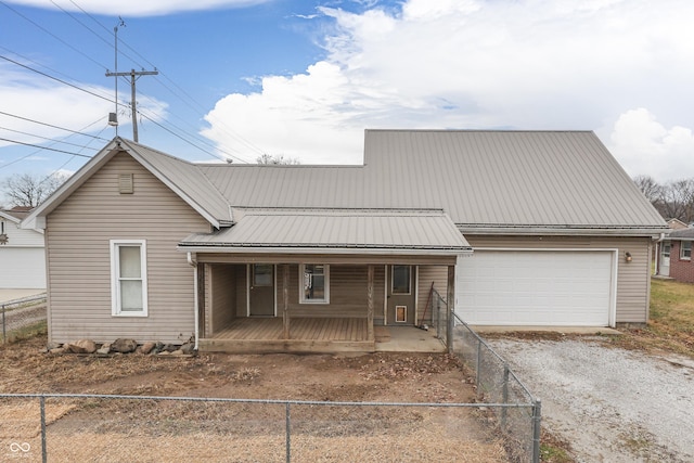 view of front of property featuring a porch and a garage