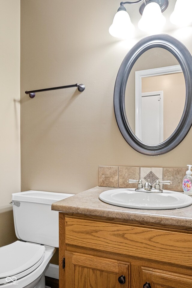 bathroom featuring vanity and toilet