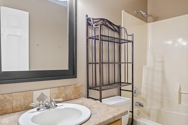 full bathroom featuring vanity, toilet, and tub / shower combination