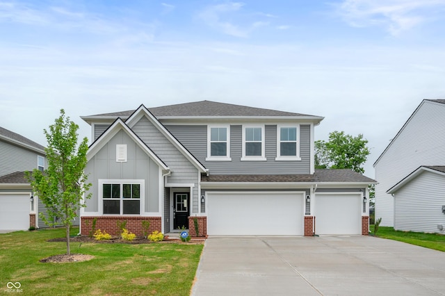 view of front facade featuring a front yard and a garage