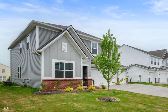 view of front of home with a garage and a front lawn