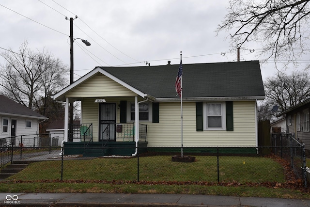 bungalow featuring a front lawn and covered porch