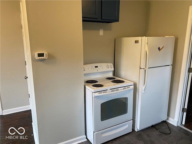 kitchen featuring white appliances and dark wood-type flooring