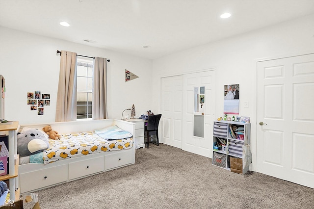 bedroom featuring carpet and a closet