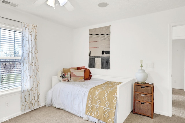 carpeted bedroom with ceiling fan