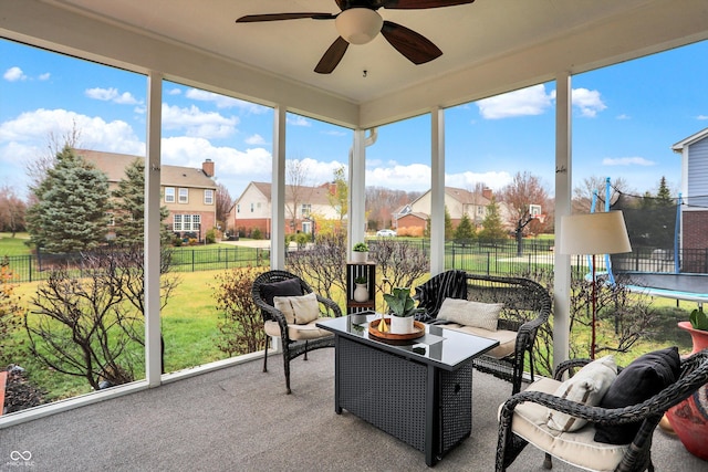 sunroom / solarium with ceiling fan