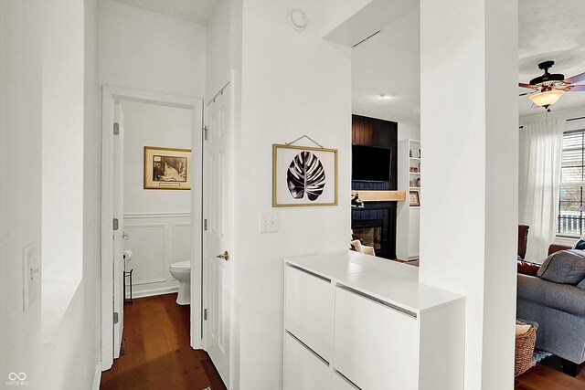 corridor featuring dark hardwood / wood-style flooring