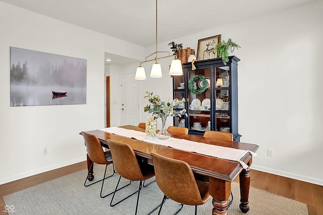 dining area featuring wood-type flooring