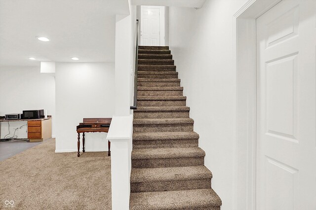 staircase with carpet