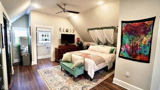 bedroom with vaulted ceiling, baseboards, dark wood-style flooring, and ceiling fan