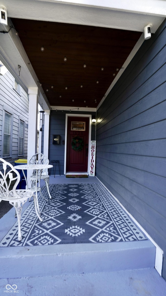 doorway to property featuring covered porch