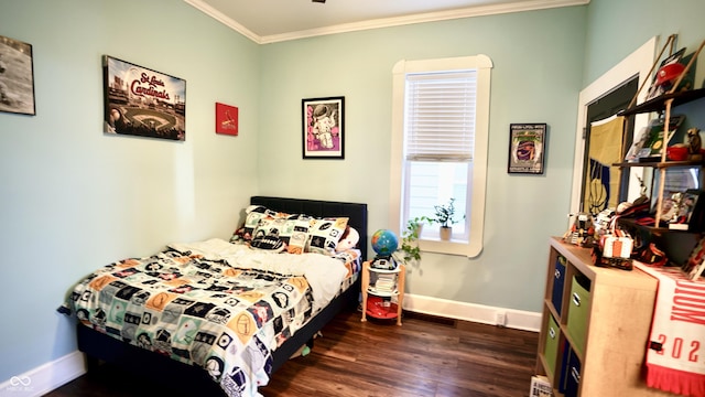 bedroom featuring crown molding, baseboards, and dark wood-style flooring