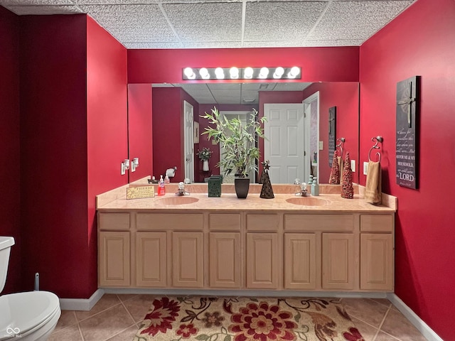 bathroom featuring vanity, tile patterned flooring, and toilet