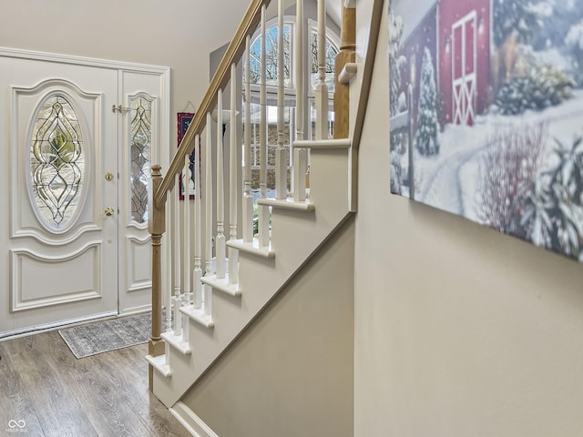 entryway with hardwood / wood-style flooring