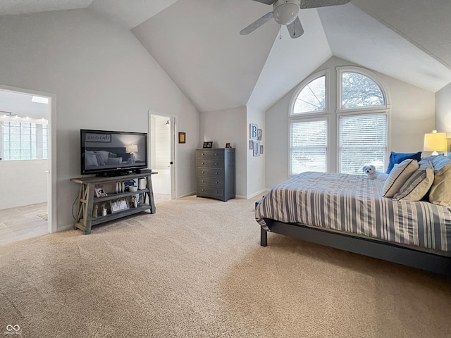 carpeted bedroom featuring high vaulted ceiling and ceiling fan