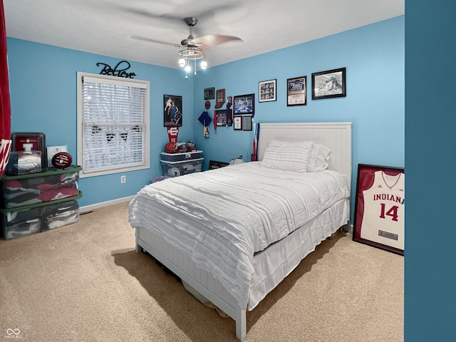 carpeted bedroom with ceiling fan