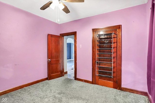 unfurnished bedroom with carpet and ceiling fan