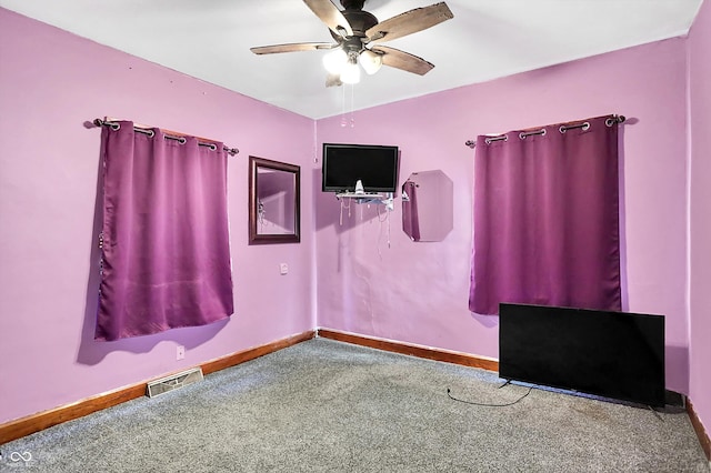 interior space featuring ceiling fan and carpet floors