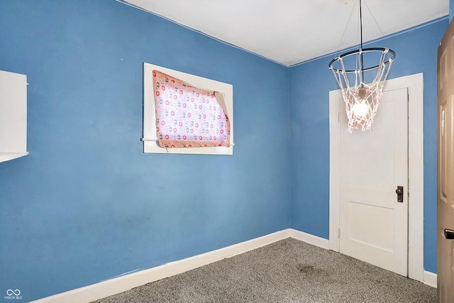 unfurnished room featuring carpet