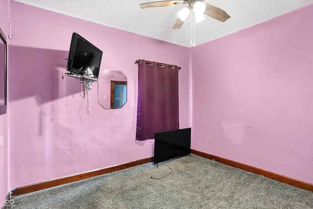 unfurnished bedroom featuring ceiling fan and carpet