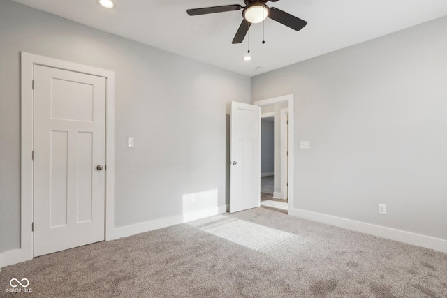 unfurnished bedroom with carpet and ceiling fan