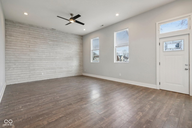 entryway with dark hardwood / wood-style flooring and ceiling fan