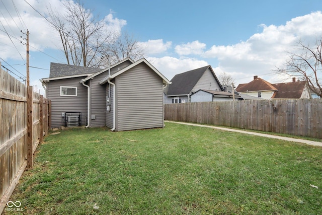 back of property featuring a yard