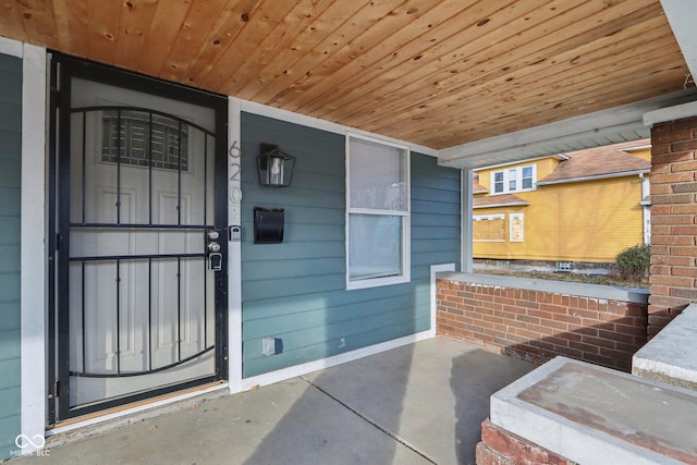 view of exterior entry featuring a porch