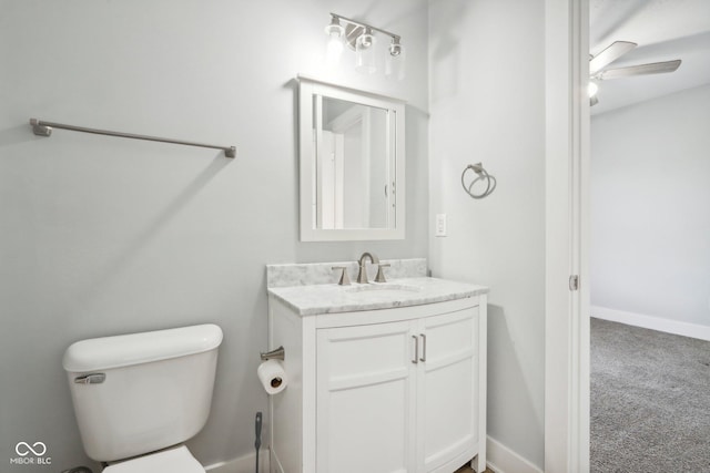 bathroom featuring ceiling fan, vanity, and toilet