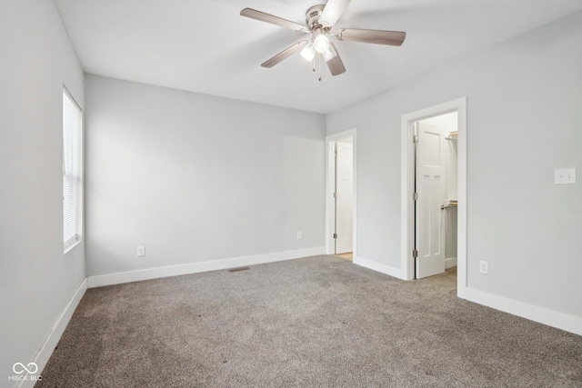 carpeted empty room with ceiling fan