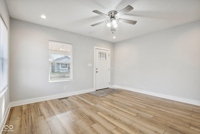 foyer entrance featuring ceiling fan and light hardwood / wood-style floors