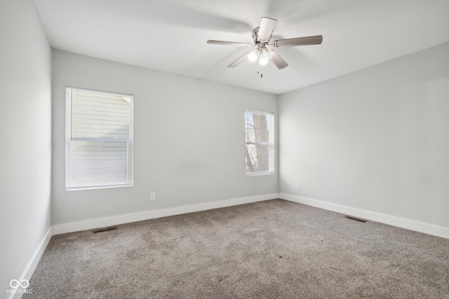 carpeted empty room with ceiling fan