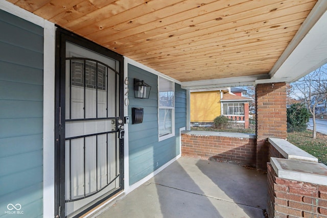 doorway to property featuring a porch