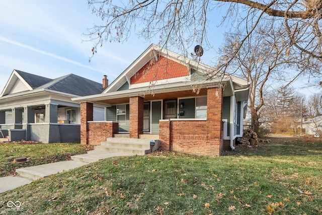 view of front of house featuring a front yard and a porch