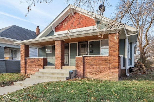 view of front of home featuring a porch and a front yard