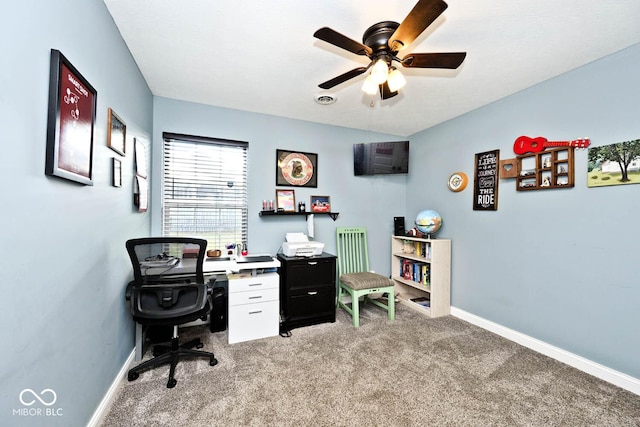 carpeted home office with ceiling fan