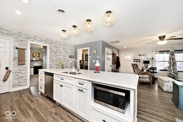 kitchen featuring white cabinets, dark hardwood / wood-style flooring, sink, and stainless steel appliances