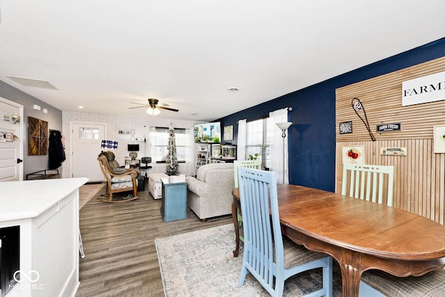 dining space featuring hardwood / wood-style floors and ceiling fan