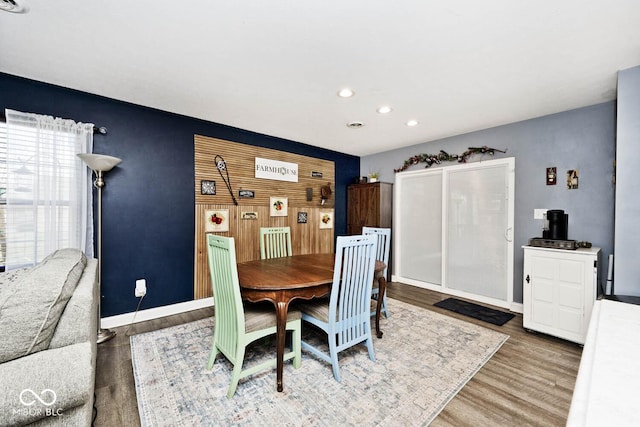 dining area with hardwood / wood-style flooring