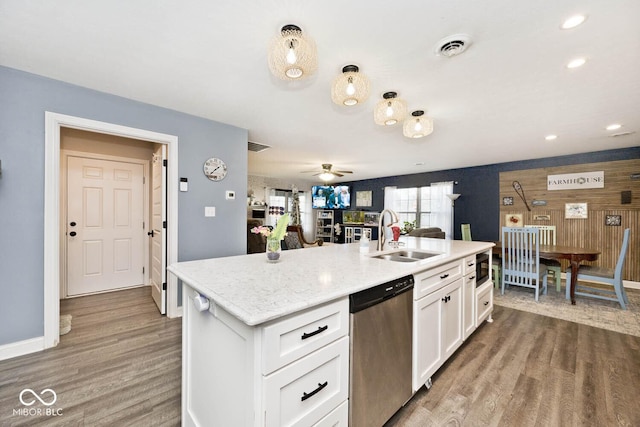 kitchen with white cabinets, ceiling fan, sink, wood-type flooring, and dishwasher